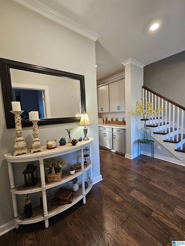 interior space featuring dark wood-type flooring and crown molding