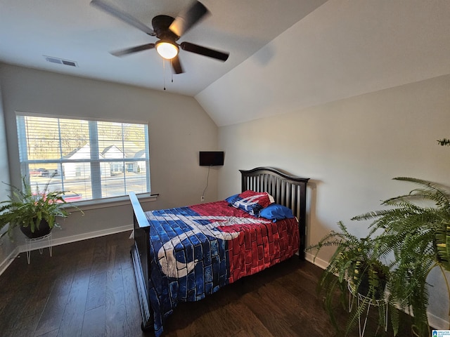 bedroom with ceiling fan, dark hardwood / wood-style flooring, and lofted ceiling