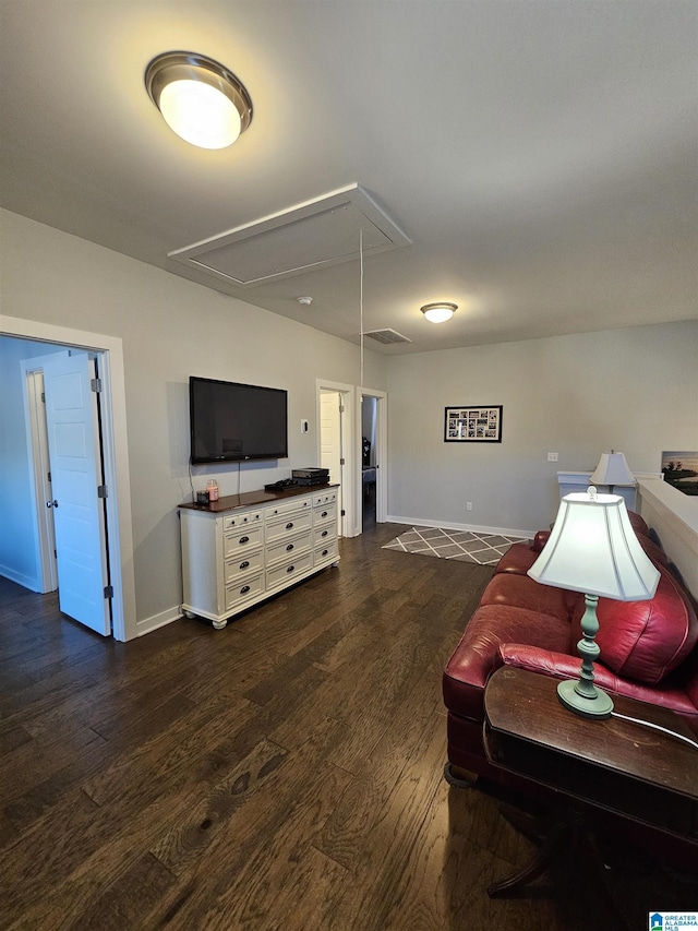 sitting room featuring dark hardwood / wood-style flooring