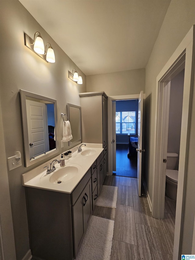 bathroom with vanity and toilet