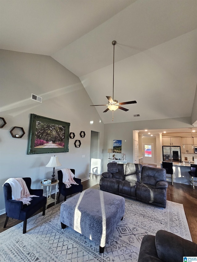 living room with lofted ceiling, wood-type flooring, and ceiling fan