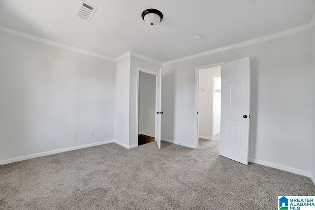 unfurnished bedroom featuring light carpet and crown molding