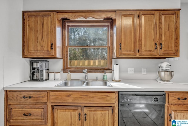 kitchen featuring sink and black dishwasher