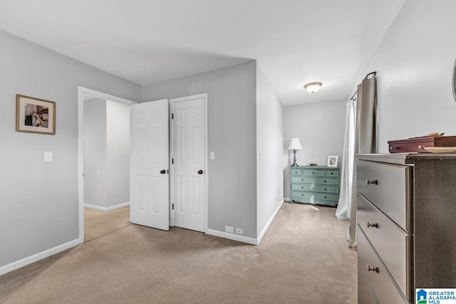 unfurnished bedroom with light colored carpet