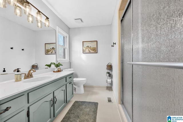 bathroom featuring an enclosed shower, vanity, and toilet