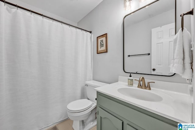 bathroom featuring toilet and vanity