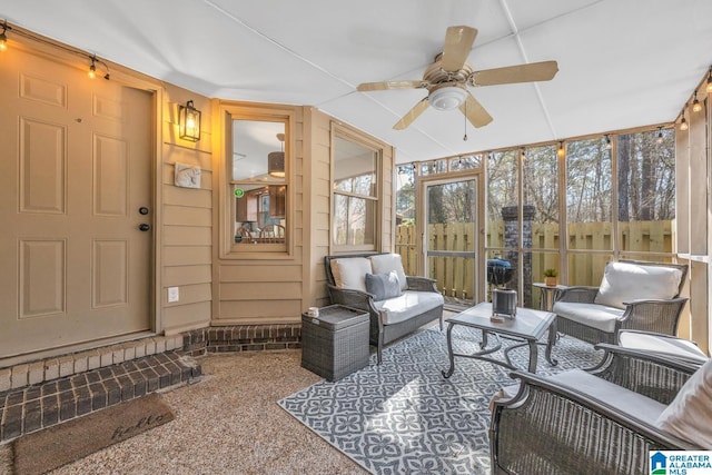 sunroom featuring ceiling fan