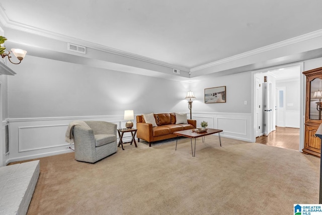 living room featuring ornamental molding and light colored carpet