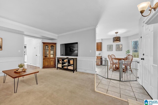 living room with light carpet and ornamental molding