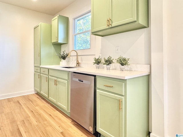 kitchen with sink, green cabinetry, dishwasher, and light hardwood / wood-style floors