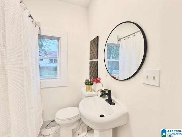 bathroom featuring toilet and sink