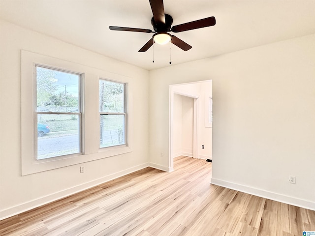 unfurnished room featuring ceiling fan and light hardwood / wood-style flooring