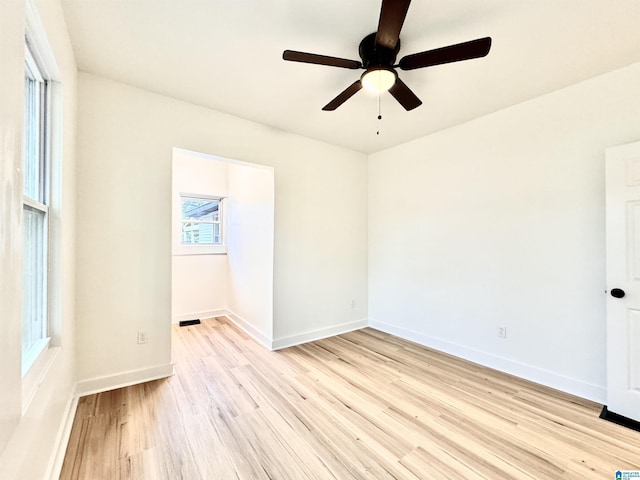 unfurnished room featuring ceiling fan and light hardwood / wood-style flooring