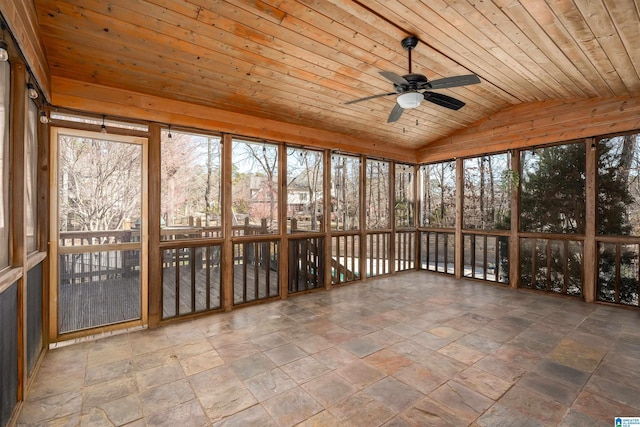 unfurnished sunroom with ceiling fan, wooden ceiling, and vaulted ceiling