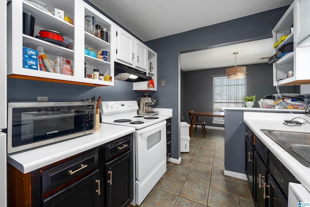 kitchen with pendant lighting, white cabinets, white appliances, a textured ceiling, and sink