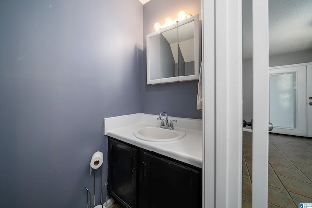 bathroom with vanity and tile patterned flooring