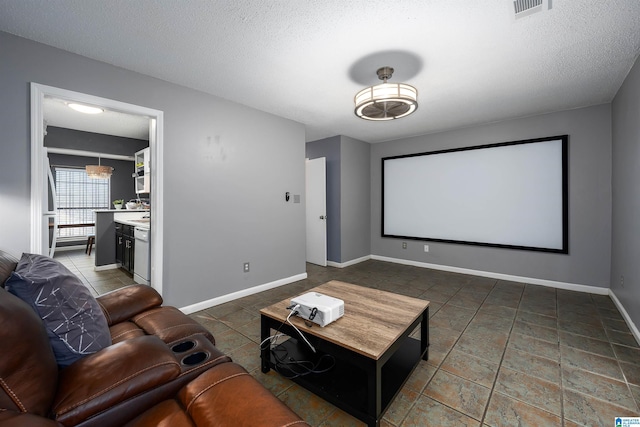 home theater room with a textured ceiling