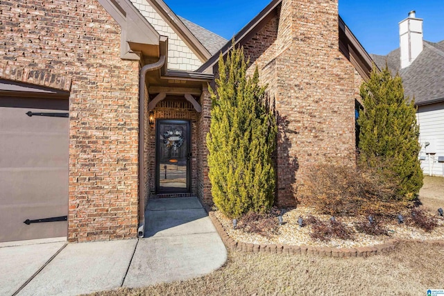 doorway to property featuring a garage