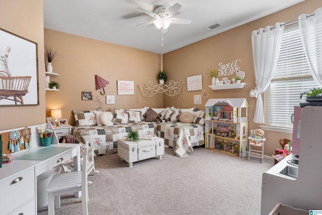 bedroom featuring ceiling fan and carpet