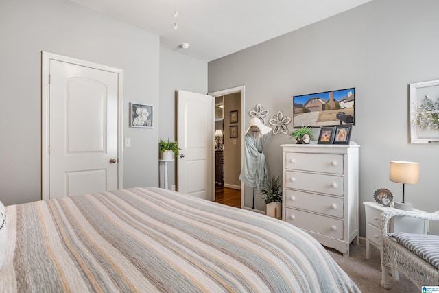 bedroom featuring dark carpet