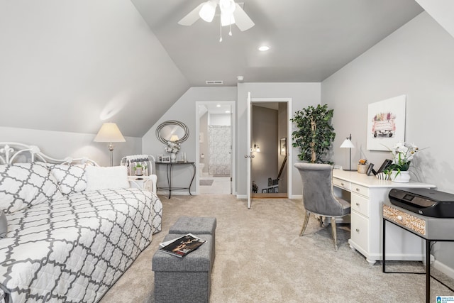 carpeted bedroom with vaulted ceiling, ensuite bathroom, and ceiling fan