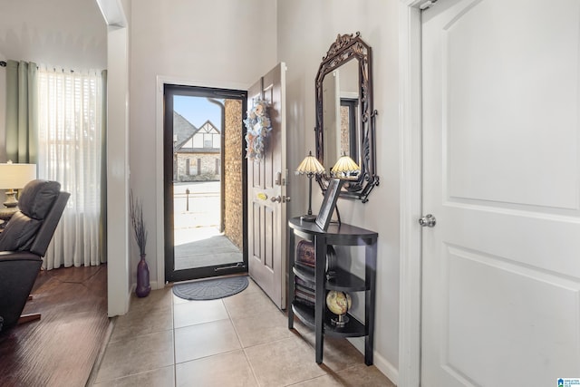 foyer featuring a wealth of natural light and light tile patterned floors