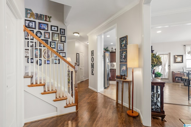 entrance foyer featuring hardwood / wood-style flooring and ornamental molding