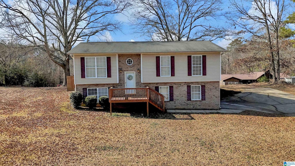 raised ranch with a wooden deck