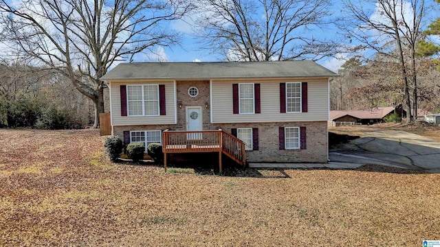 raised ranch with a wooden deck