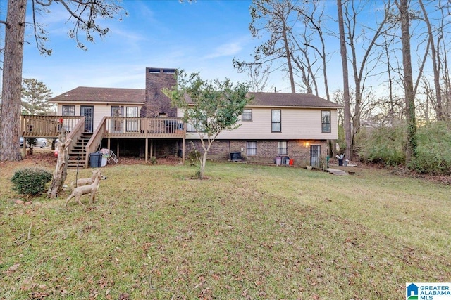 back of house with central AC, a deck, and a yard