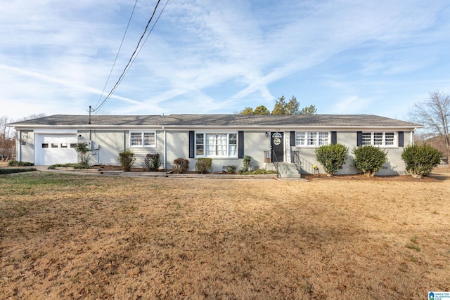 ranch-style home with a garage and a front lawn