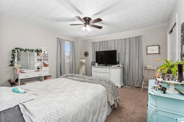 bedroom with a textured ceiling, ceiling fan, and light colored carpet