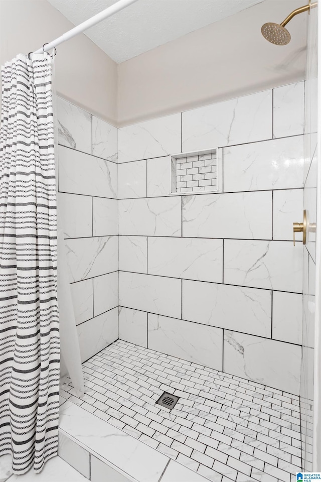 bathroom with a shower with shower curtain