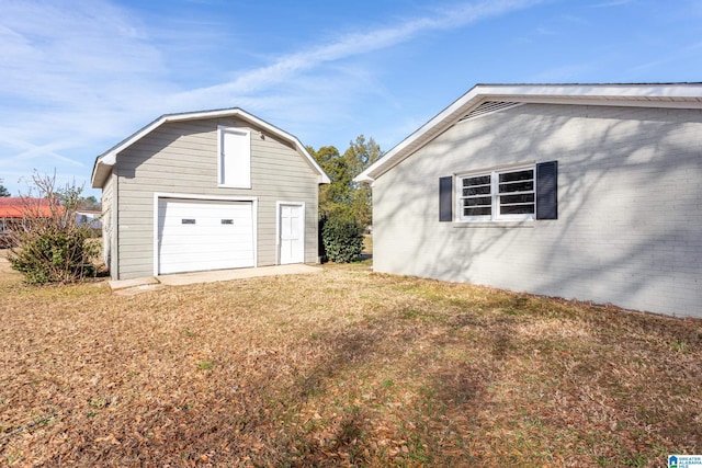 garage with a yard