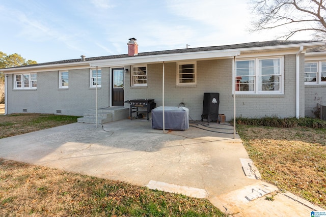 back of property featuring a patio area