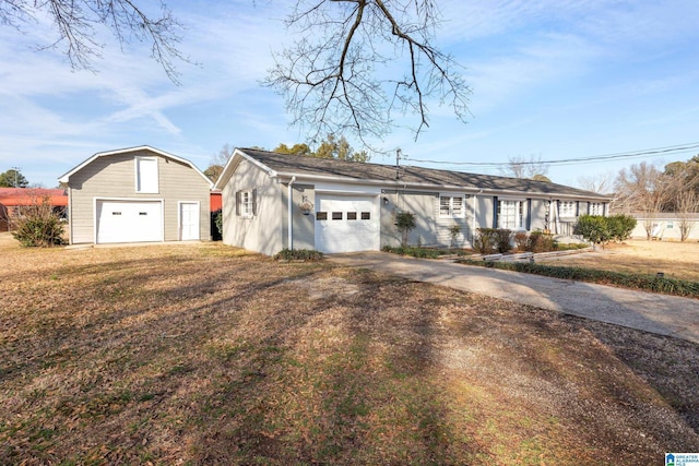 single story home with a garage, an outdoor structure, and a front lawn