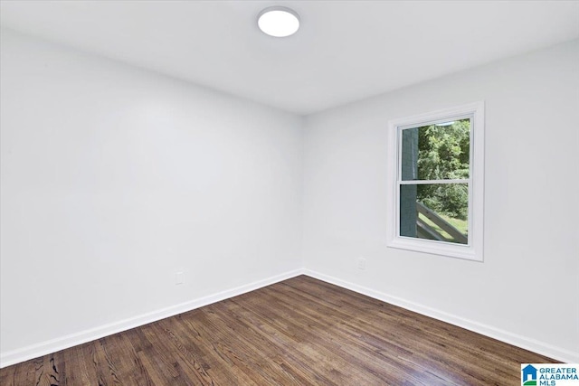 empty room with hardwood / wood-style flooring