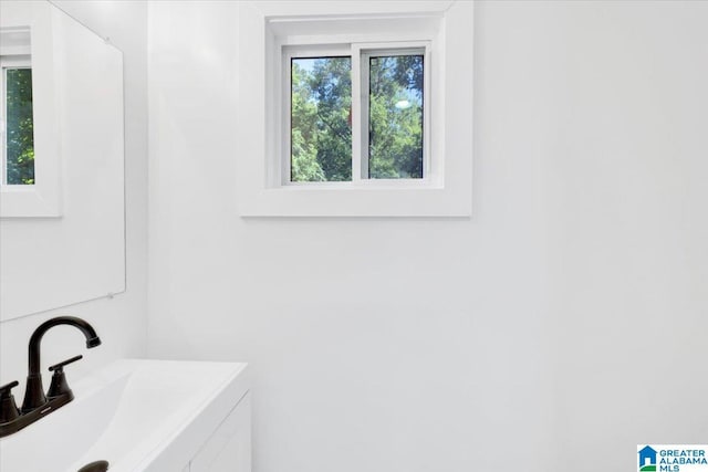 bathroom with sink and a healthy amount of sunlight