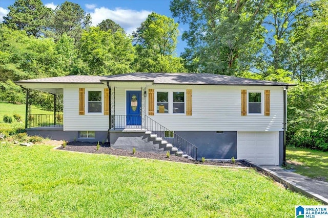 view of front of property with a garage and a front lawn