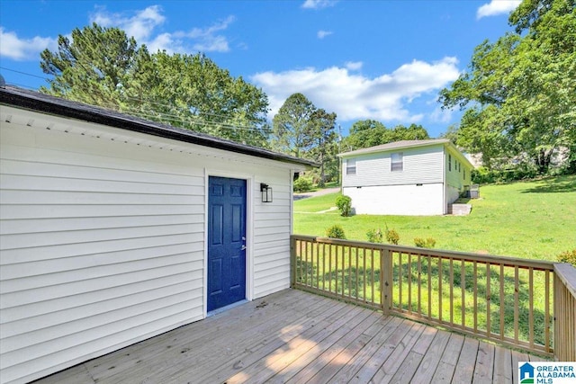 wooden deck with a lawn