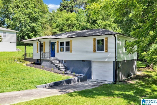 view of front of property with a front lawn and a garage