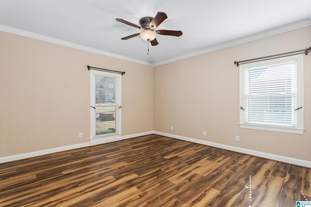 empty room featuring ceiling fan, dark hardwood / wood-style flooring, and crown molding