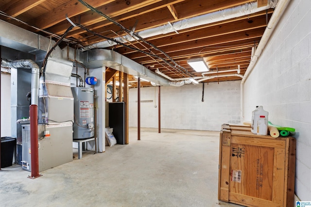 basement featuring heating unit and gas water heater