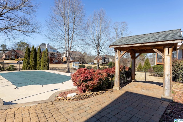 view of swimming pool with a gazebo and a patio