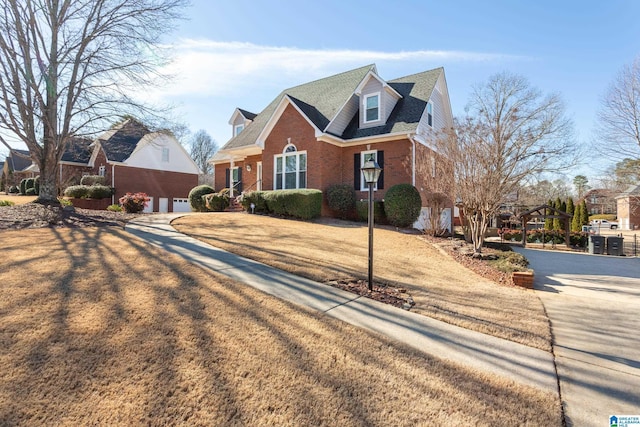 view of front of house with a front lawn and a garage