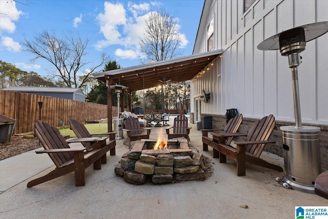 view of patio / terrace with an outdoor fire pit