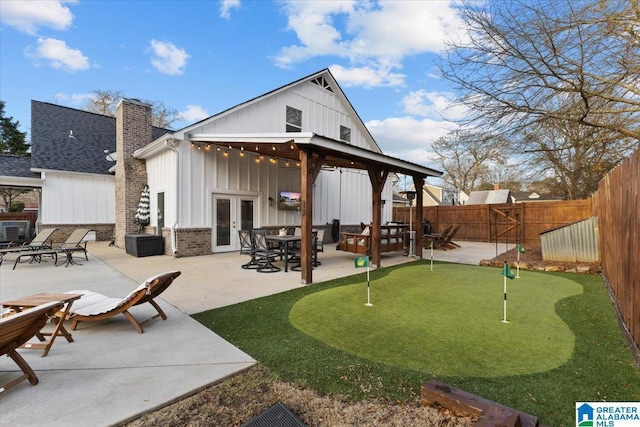 back of house featuring a gazebo, a patio, and french doors