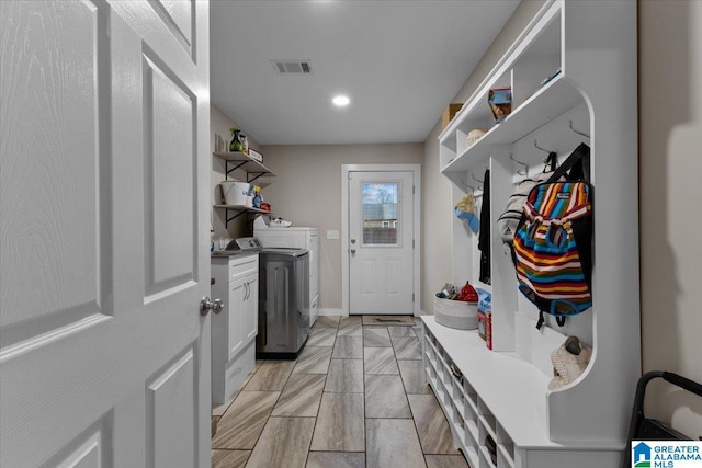 laundry area featuring cabinets and independent washer and dryer