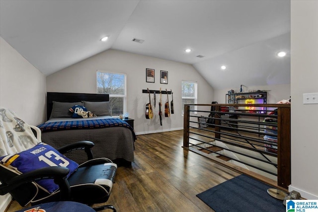 bedroom with dark hardwood / wood-style flooring and vaulted ceiling