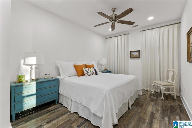 bedroom featuring dark hardwood / wood-style flooring and ceiling fan